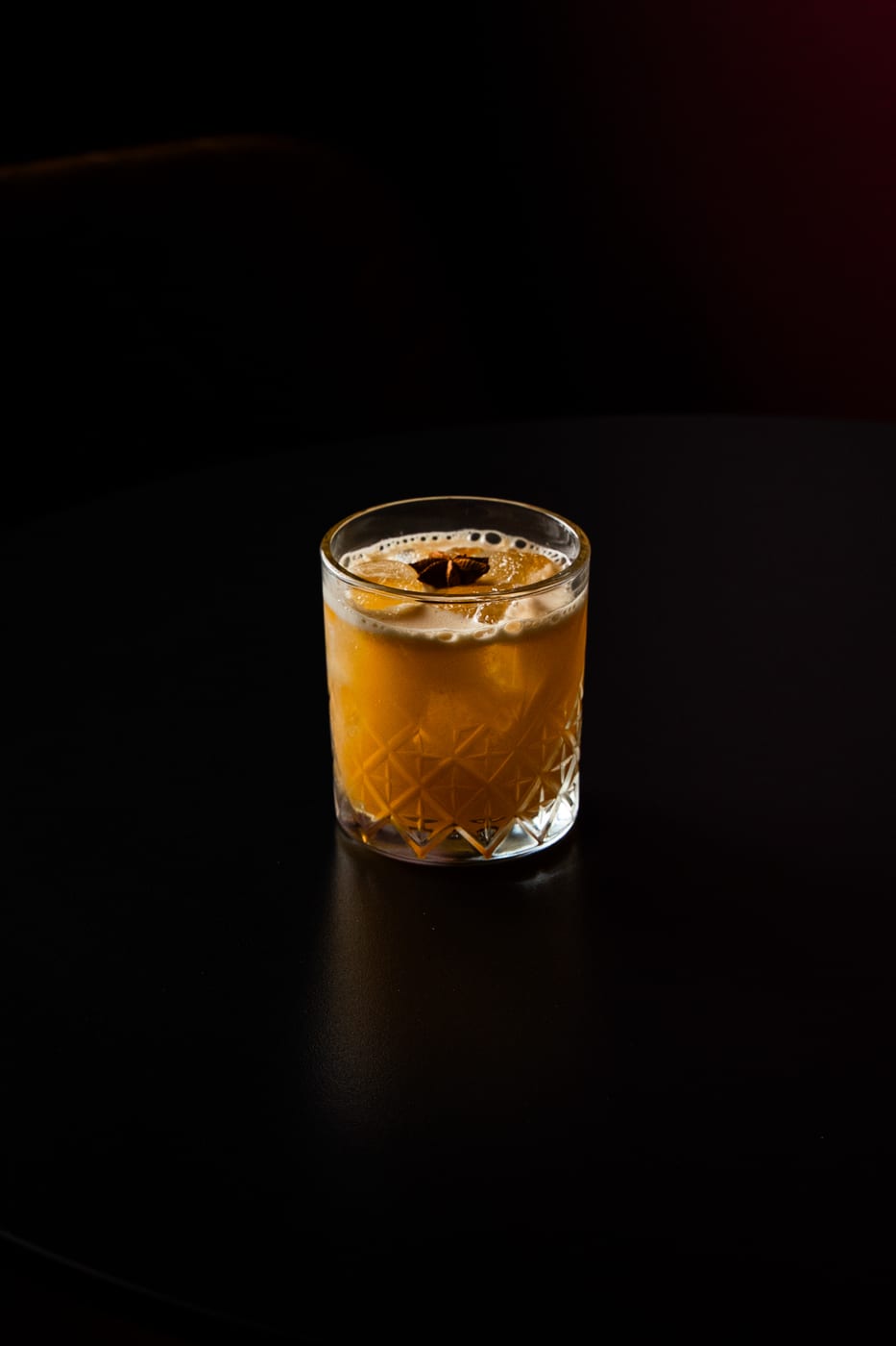 Bourbon Barrel signature cocktail at OCCO Business Bay Dubai — bourbon and passion fruit cocktail with star anise