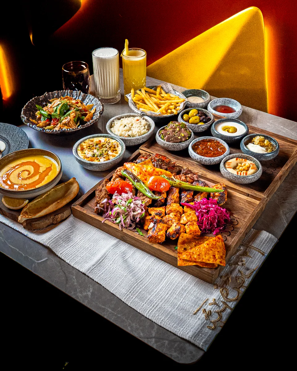 A mixed grill board with mezze bowls at OCCO Hessa